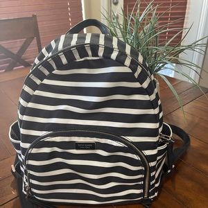 Kate Spade medium sized black and white striped backpack.